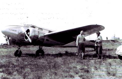 Photograph of the Lockheed 12A. It shows Mac Job, also a pilot and a friend.