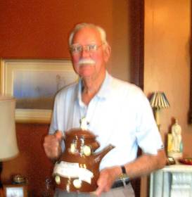 Mr. Donald Beard AM FRCSEd, FRACS, holding the trophy for a cricket match between the Mike Benness English Supporters’ Team and Donald Beard’s Taverners Team 17/12/1982.